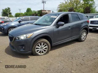 2014 Mazda CX-5 Touring z VIN JM3KE4CY5E0429958, wystawiony jako Copart lot #56866465 z przebiegiem 154 025 mil mil oraz Szkody całkowita. Historia ofert i sprzedaży dostępna na DreamBid. Obrazek 1.