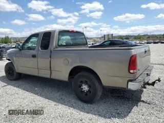 2001 Ford F-150 with VIN 1FTPX17L21NA37619, listed as a Copart auction lot 56922485 with 212,148 mi miles and Salvage title. Bid and sale history available at DreamBid. Image 2.