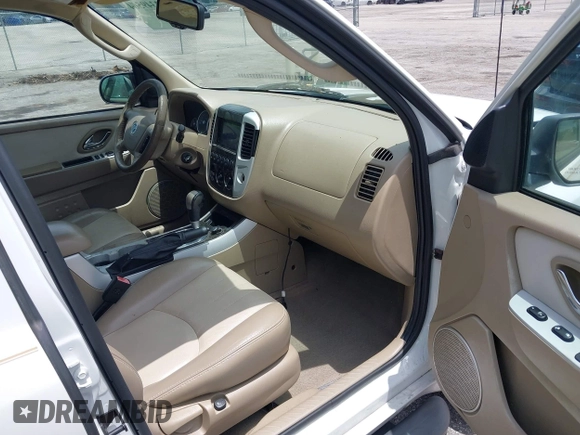 2006 Mercury Mariner Luxury with VIN 4M2YU56116KJ14472, listed as a IAAI auction lot 42349564 with 96,221 mi miles and . Bid and sale history available at DreamBid. Image 5.