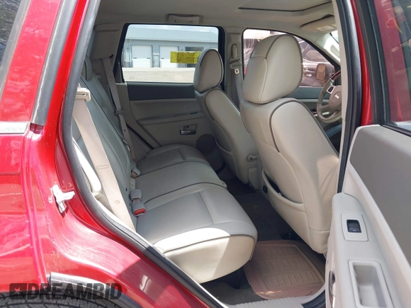 2009 Jeep Grand Cherokee with VIN 1J8HR68T79C539925, listed as a IAAI auction lot 42157077 with 140,443 mi miles and . Bid and sale history available at DreamBid. Image 8.