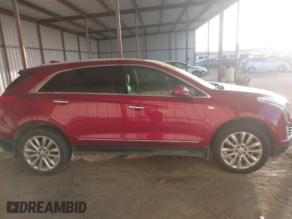 2019 Cadillac XT5 Premium Luxury FWD z VIN 1GYKNERS0KZ157287, wystawiony jako IAAI lot #41106524 z przebiegiem 131 464 mil mil oraz . Historia ofert i sprzedaży dostępna na DreamBid. Obrazek 13.