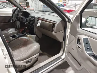 2000 Jeep Grand Cherokee Laredo z VIN 1J4GW48NXYC244327, wystawiony jako IAAI lot #41832166 z przebiegiem 250 822 mil mil oraz . Historia ofert i sprzedaży dostępna na DreamBid. Obrazek 5.