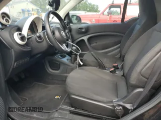 2016 Smart fortwo Passion z VIN WMEFJ5DA6GK057472, wystawiony jako Copart lot #74035244 z przebiegiem 67 826 mil mil oraz Szkoda całkowita • Salvage title. Historia ofert i sprzedaży dostępna na DreamBid. Obrazek 7.