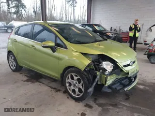 2011 Ford Fiesta SES with VIN 3FADP4FJ7BM127600, listed as a IAAI auction lot 41657170 with 135,483 mi miles. Bid and sale history available at carsss.com. Image 1.