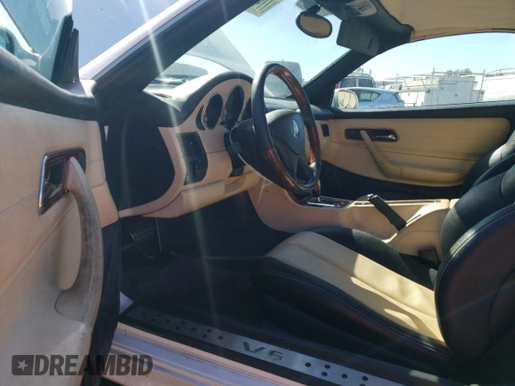 2001 Mercedes-Benz SLK 230/320 with VIN WDBKK65F41F235419, listed as a Copart auction lot 77407374 with 79,238 mi miles and Salvage Title. Bid and sale history available at DreamBid. Image 8.