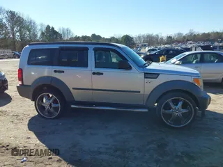 2007 Dodge Nitro SXT with VIN 1D8GT28K97W642118, listed as a IAAI auction lot 41276172 with 385,441 mi miles. Bid and sale history available at carsss.com. Image 13.