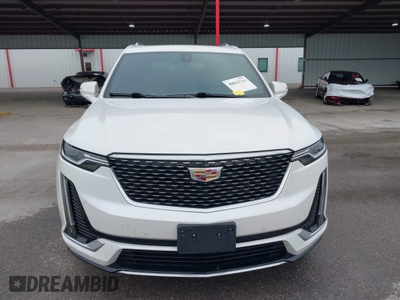 2021 Cadillac XT6 Premium Luxury z VIN 1GYKPCRS8MZ233209, wystawiony jako IAAI lot #40012714 z przebiegiem 45 599 mil mil oraz . Historia ofert i sprzedaży dostępna na DreamBid. Obrazek 12.