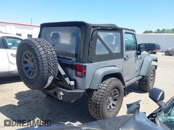 2015 Jeep Wrangler Sport with VIN 1C4AJWAG3FL696988, listed as a IAAI auction lot 41999036 with 79,064 mi miles. Bid and sale history available at carsss.com. Image 4.