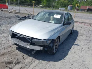 2013 BMW 3 Series 328i with VIN WBA3A5C57DF356069, listed as a IAAI auction lot 42078635 with 140,669 mi miles. Bid and sale history available at carsss.com. Image 2.