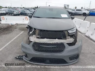 2023 Chrysler Pacifica Hybrid Touring L with VIN 2C4RC1L71PR584485, listed as a IAAI auction lot 42056423 with 58,955 mi miles and . Bid and sale history available at DreamBid. Image 13.