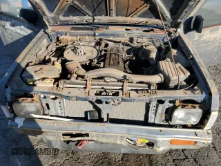 1991 Nissan Frontier z VIN 1N6SD11S2MC350332, wystawiony jako Copart lot #87462534 z przebiegiem 350 692 mil mil oraz Szkoda całkowita • Salvage title. Historia ofert i sprzedaży dostępna na DreamBid. Obrazek 11.
