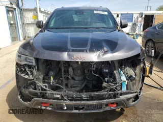 2017 Jeep Grand Cherokee Trailhawk with VIN 1C4RJFLGXHC654112, listed as a Copart auction lot 56397195 with 168,136 mi miles and Salvage title. Bid and sale history available at DreamBid. Image 5.