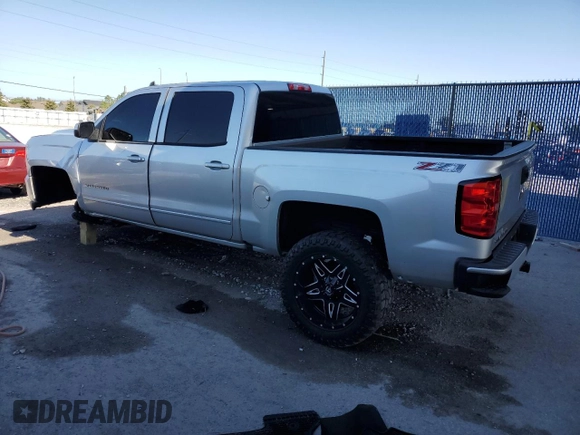 2017 Chevrolet Silverado 1500 LT with VIN 3GCUKREC0HG470703, listed as a Copart auction lot 53667145 with 167,689 mi miles and Salvage Title. Bid and sale history available at DreamBid. Image 2.
