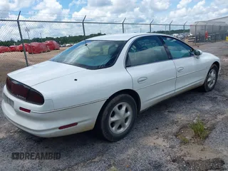 1995 Oldsmobile Aurora z VIN 1G3GR62C8S4147628, wystawiony jako IAAI lot #42361531 z przebiegiem 189 111 mil mil oraz . Historia ofert i sprzedaży dostępna na DreamBid. Obrazek 4.