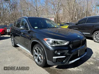 2017 BMW X1 xDrive28i with VIN WBXHT3C32H5F67896, listed as a IAAI auction lot 41823288 with 80,130 mi miles. Bid and sale history available at carsss.com. Image 1.