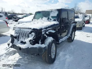 2014 Jeep Wrangler Sport with VIN 1C4AJWAG5EL285994, listed as a IAAI auction lot 41558673 with 98,779 mi miles. Bid and sale history available at carsss.com. Image 2.