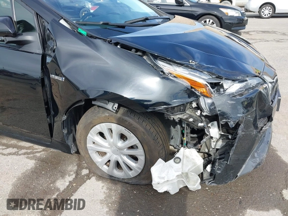 2022 Toyota Prius L Eco with VIN JTDKAMFU2N3157283, listed as a IAAI auction lot 41620334 with 59,754 mi miles and . Bid and sale history available at DreamBid. Image 6.
