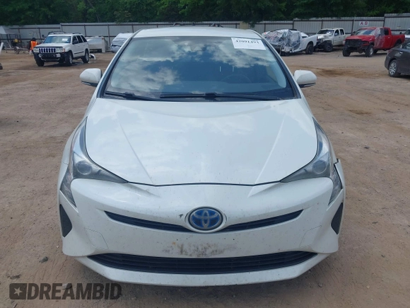 2017 Toyota Prius Two with VIN JTDKARFUXH3040780, listed as a IAAI auction lot 42091493 with 105,952 mi miles and . Bid and sale history available at DreamBid. Image 6.