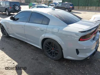 2022 Dodge Charger Scat Pack Widebody with VIN 2C3CDXGJ6NH176650, listed as a IAAI auction lot 41863122 with 34,569 mi miles and . Bid and sale history available at DreamBid. Image 3.