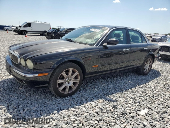2004 Jaguar XJ with VIN SAJEA71C14SG10928, listed as a Copart auction lot 51202785 with 164,300 mi miles and Salvage Title. Bid and sale history available at carsss.com. Image 1.