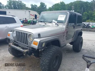 2002 Jeep Wrangler Sport with VIN 1J4FA49S52P717811, listed as a IAAI auction lot 42449753 with 252,258 mi miles and . Bid and sale history available at DreamBid. Image 2.