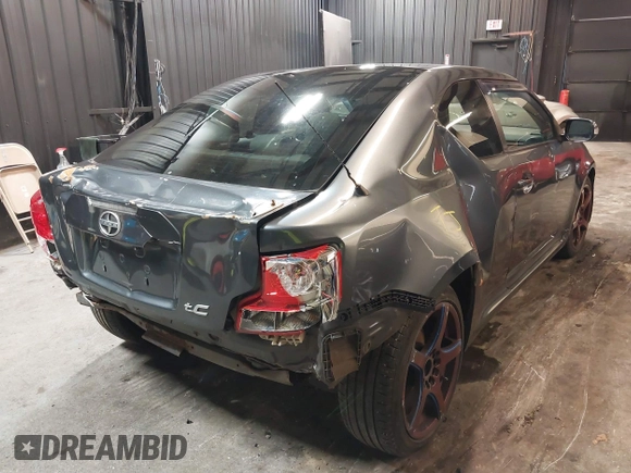 2012 Scion tC with VIN JTKJF5C7XC3034998, listed as a IAAI auction lot 41591632 with 171,121 mi miles. Bid and sale history available at carsss.com. Image 4.