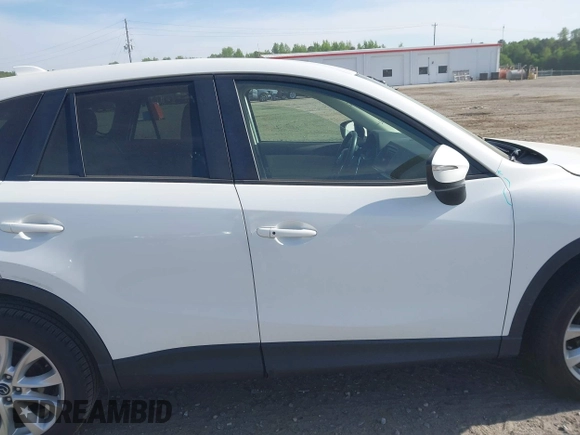 2015 Mazda CX-5 Grand Touring with VIN JM3KE2DY5F0498718, listed as a IAAI auction lot 42070000 with 129,327 mi miles. Bid and sale history available at carsss.com. Image 14.
