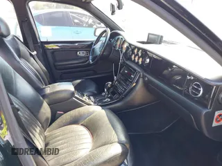 2001 Bentley Arnage with VIN SCBLC31E11CX06297, listed as a IAAI auction lot 41980275 with 63,510 mi miles and . Bid and sale history available at DreamBid. Image 5.