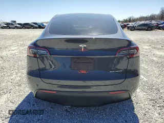 2025 Tesla Model Y Long Range with VIN 7SAYGAEEXSF253326, listed as a Copart auction lot 49527965 with 5,803 mi miles and Salvage Title. Bid and sale history available at DreamBid. Image 6.