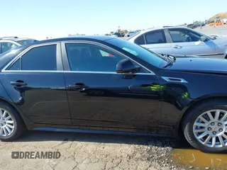 2013 Cadillac CTS Luxury with VIN 1G6DE5E51D0165634, listed as a IAAI auction lot 42208023 with 92,827 mi miles and . Bid and sale history available at DreamBid. Image 13.