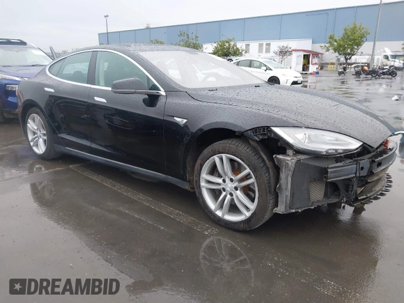 2013 Tesla Model S with VIN 5YJSA1CN0DFP20053, listed as a IAAI auction lot 41470660 with 61,568 mi miles and . Bid and sale history available at DreamBid. Image 1.