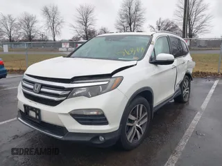 2016 Honda Pilot Touring with VIN 5FNYF6H95GB062089, listed as a IAAI auction lot 41810378 with 74,704 mi miles and . Bid and sale history available at DreamBid. Image 17.