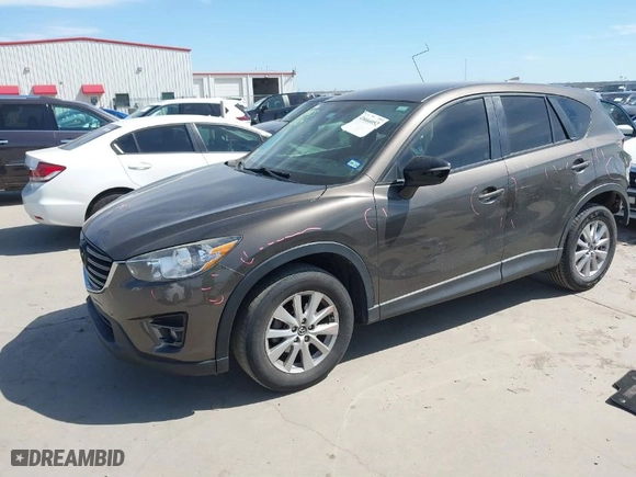 2016 Mazda CX-5 Touring with VIN JM3KE2CY0G0860828, listed as a IAAI auction lot 41666052 with NaN miles. Bid and sale history available at carsss.com. Image 2.