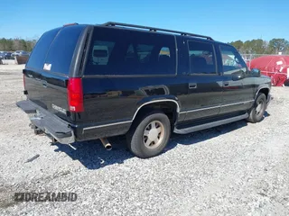 1999 Chevrolet Suburban with VIN 3GNEC16R0XG137834, listed as a IAAI auction lot 41853492 with 296,147 mi miles. Bid and sale history available at carsss.com. Image 4.