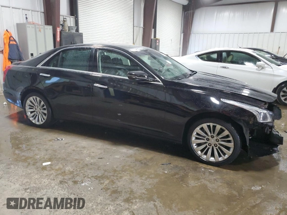2015 Cadillac CTS Performance AWD with VIN 1G6AY5S3XF0131806, listed as a Copart auction lot 58422704 with 69,544 mi miles and Salvage Title. Bid and sale history available at DreamBid. Image 4.