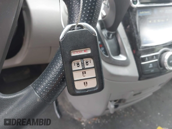 2016 Honda Odyssey SE with VIN 5FNRL5H38GB111448, listed as a IAAI auction lot 41754302 with 114,282 mi miles and . Bid and sale history available at DreamBid. Image 11.