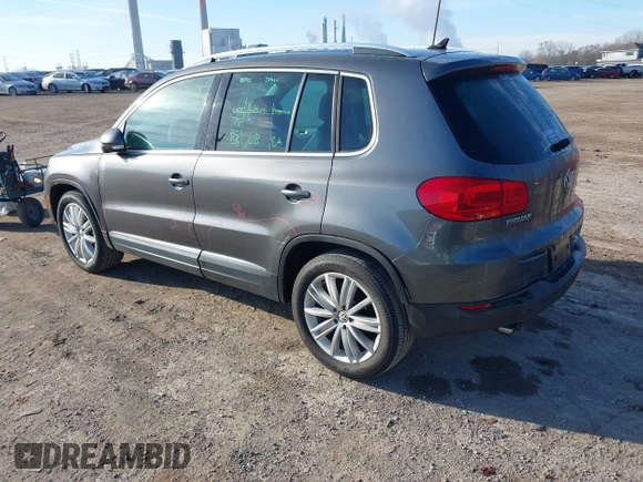2012 Volkswagen Tiguan SEL with VIN WVGAV7AX2CW000962, listed as a IAAI auction lot 40815475 with 162,859 mi miles and . Bid and sale history available at DreamBid. Image 3.