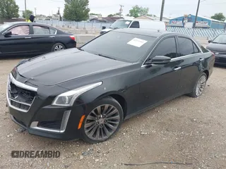 2014 Cadillac CTS Luxury AWD with VIN 1G6AX5SX9E0197395, listed as a IAAI auction lot 42211452 with 90,657 mi miles and . Bid and sale history available at DreamBid. Image 18.