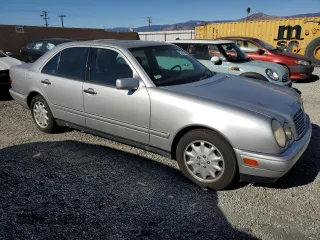 1998 Mercedes-Benz E 320 with VIN WDBJF25F9WA697018, listed as a Copart auction lot 87567315 with 107,255 mi miles and Clean Title. Bid and sale history available at DreamBid. Image 4.