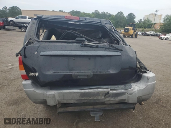 2000 Jeep Grand Cherokee Laredo with VIN 1J4G248S4YC390675, listed as a Copart auction lot 55652815 with Not provided miles and Salvage title. Bid and sale history available at DreamBid. Image 6.