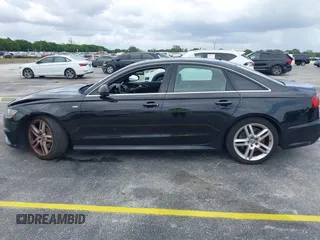 2016 Audi A6 2.0T Premium Plus with VIN WAUGFAFC6GN055826, listed as a IAAI auction lot 42011778 with 98,210 mi miles. Bid and sale history available at carsss.com. Image 14.