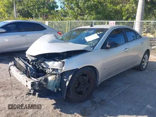 2009 Pontiac G6 w/1SA *Ltd Avail* with VIN 1G2ZG57B594156522, listed as a IAAI auction lot 40931964 with 197,196 mi miles. Bid and sale history available at carsss.com. Image 2.