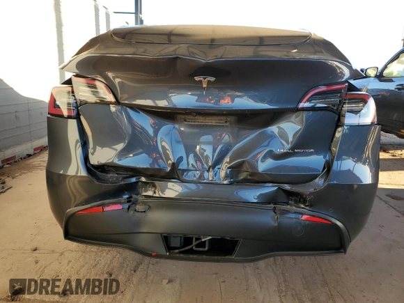 2021 Tesla Model Y Long Range with VIN 5YJYGDEEXMF151557, listed as a Copart auction lot 54936885 with 106,411 mi miles and Salvage Title. Bid and sale history available at DreamBid. Image 6.