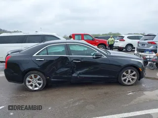 2014 Cadillac ATS Luxury AWD z VIN 1G6AH5SX0E0196052, wystawiony jako IAAI lot #41995886 z przebiegiem 97 531 mil mil oraz . Historia ofert i sprzedaży dostępna na DreamBid. Obrazek 13.
