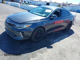 2016 Kia Optima SX Turbo with VIN 5XXGW4L29GG091635, listed as a IAAI auction lot 41884813 with 121,764 mi miles and . Bid and sale history available at carsss.com. Image 2.