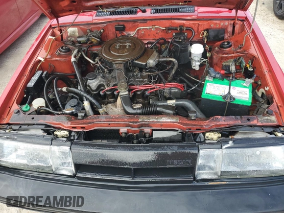 1987 Nissan Sentra z VIN JN1PB2411HU026525, wystawiony jako Copart lot #78997744 z przebiegiem 65 716 mil mil oraz Nie do naprawy • Non repairable. Historia ofert i sprzedaży dostępna na DreamBid. Obrazek 11.