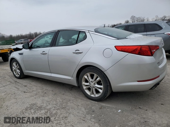 2013 Kia Optima EX z VIN 5XXGN4A7XDG144632, wystawiony jako Copart lot #83599614 z przebiegiem 97 316 mil mil oraz Szkoda całkowita • Salvage title. Historia ofert i sprzedaży dostępna na DreamBid. Obrazek 2.