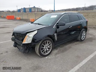 2015 Cadillac SRX Performance Collection with VIN 3GYFNFE35FS546905, listed as a IAAI auction lot 41588405 with 145,620 mi miles. Bid and sale history available at carsss.com. Image 2.