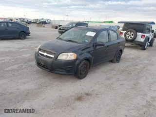 2009 Chevrolet Aveo LT w/1LT with VIN KL1TD56E09B626562, listed as a IAAI auction lot 41876182 with 108,496 mi miles. Bid and sale history available at carsss.com. Image 2.