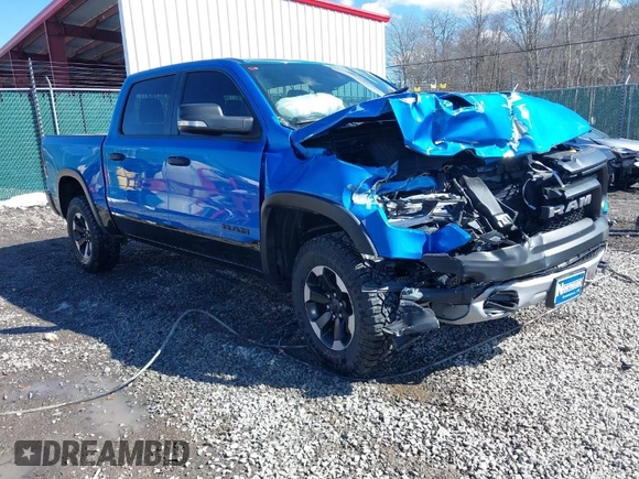 2022 Ram 1500 Rebel z VIN 1C6SRFLT0NN177124, wystawiony jako IAAI lot #41575076 z przebiegiem 40 065 mil mil oraz . Historia ofert i sprzedaży dostępna na DreamBid. Obrazek 1.